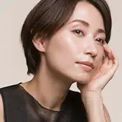 A profile view of a woman with short dark hair, emphasizing a sharp, clean jawline and a smooth, contoured neck free of loose skin. - Neck lift in San Francisco, CA